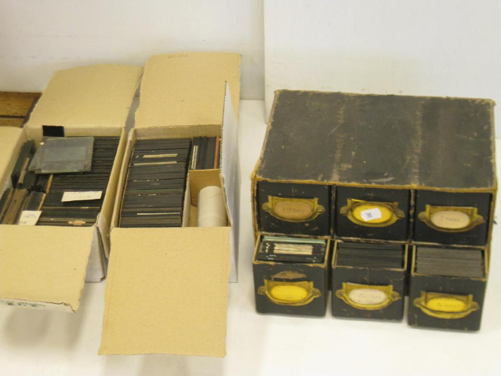 A cabinet of coloured and monochrome Lantern Slides together with