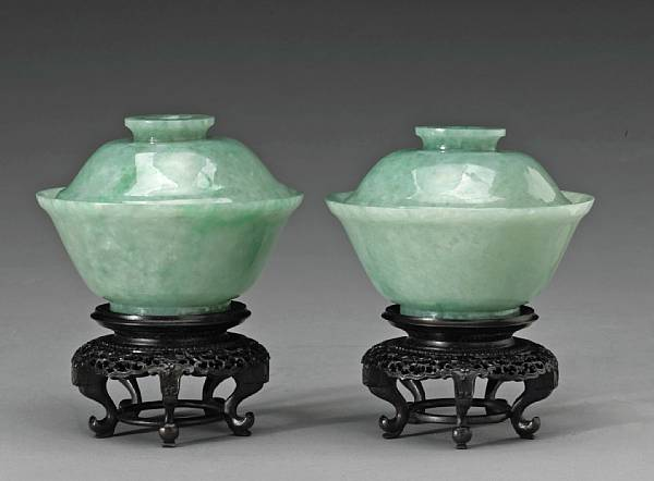 A pair of good green jadeite bowls and covers Qianlong
