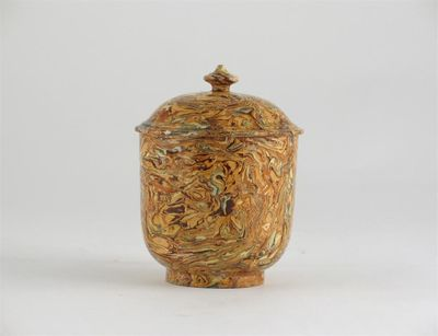 A solid agateware sugar bowl and cover with a cylindrical