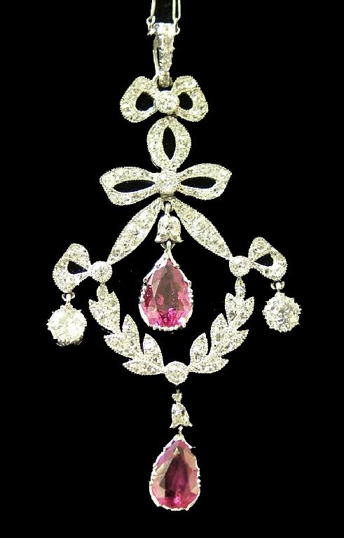 Attractive platinum ruby and diamond set drop pendant on a