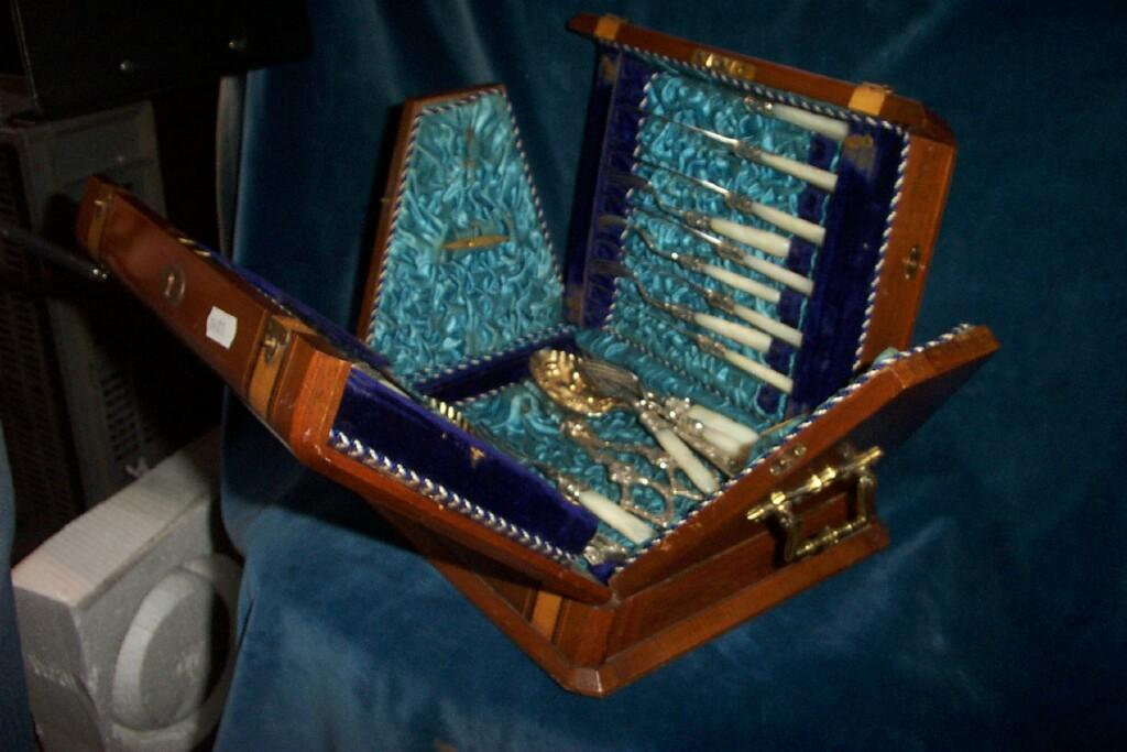 A Victorian inlaid mahogany canteen of unusual wedge shaped form
