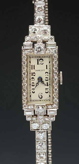 A DIAMOND SET LADIES COCKTAIL WATCH with rectangular white enamel