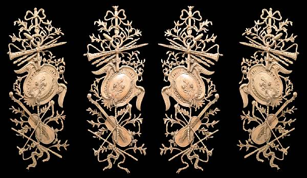 A set of four Louis XVI style hardwood architectural trophies
