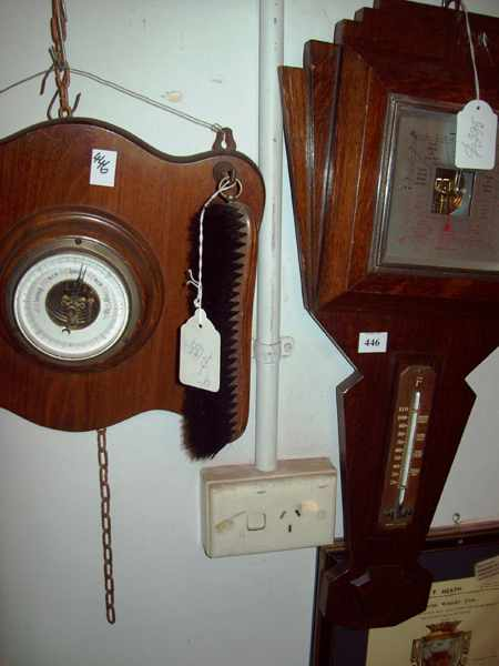 AN ANTIQUE OAK WALL BAROMETER AND ONE OTHER WALL BAROMETER