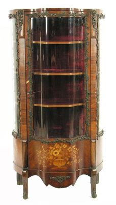 A late 19th century French rosewood and marquetry vitrine with
