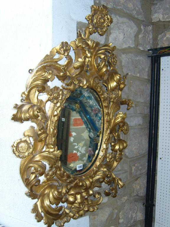 A good Florentine carved pine wall mirror the mirror plate