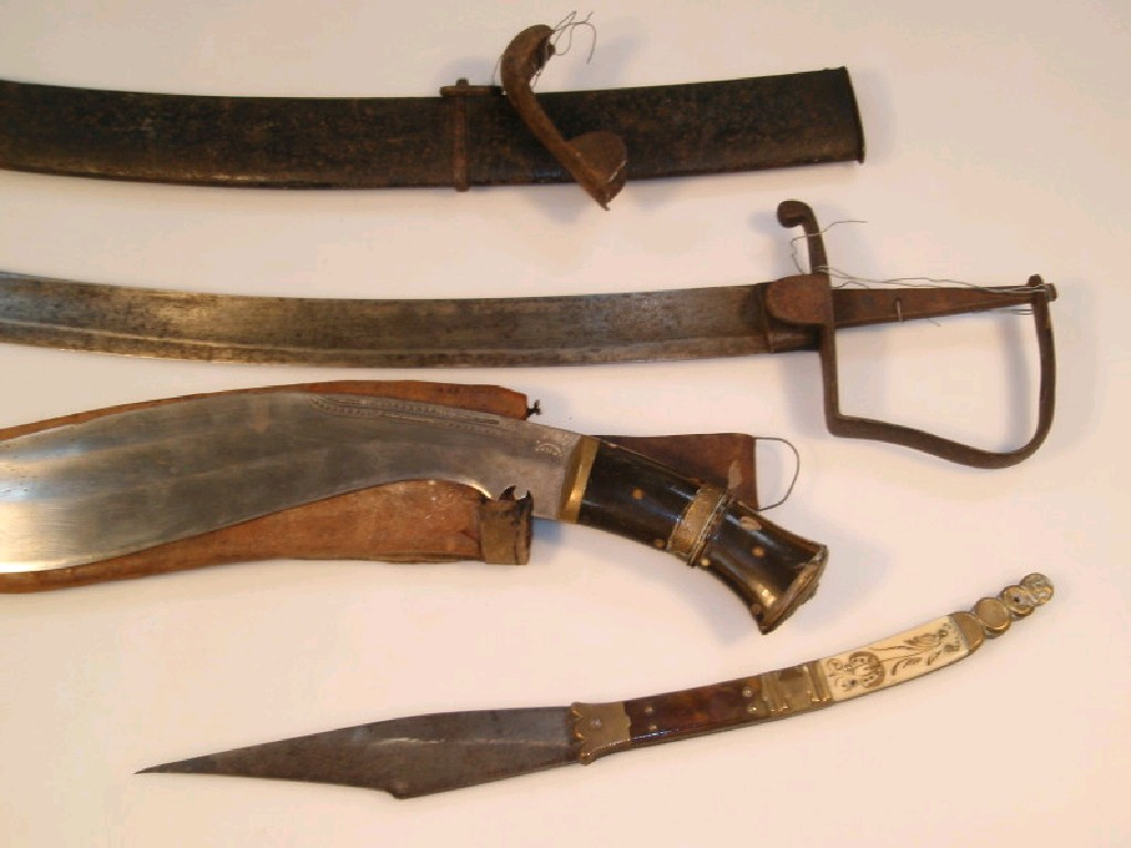 A Kukri knife with horn handle and an antique sabre