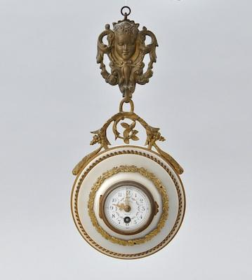 A French Alabaster and Gilt Hanging Clock with Brass Mounts