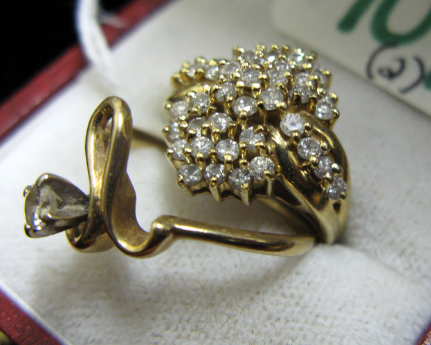 TWO DIAMOND AND FOURTEE KARAT GOLD RINGS one is set