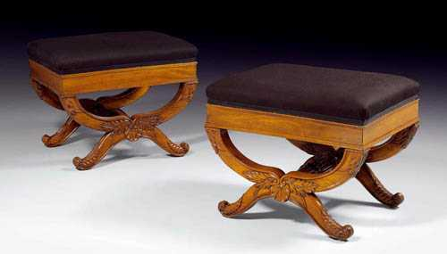 PAIR OF CARVED MAHOGANY STOOLS AUX VOLUTES late Restauration Paris