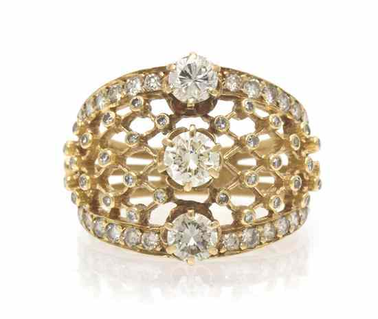 A 14 Karat Yellow Gold and Diamond Ring containing three