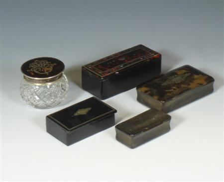 An early 20th century cut glass container with tortoiseshell lid