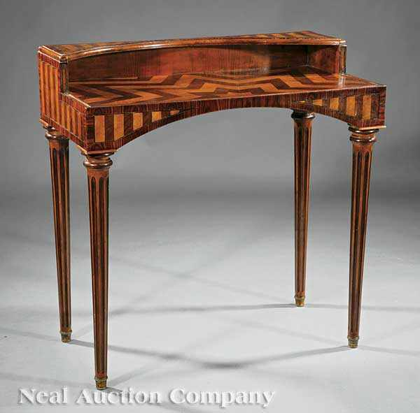 An Antique Continental Rosewood and Satinwood Parquetry Writing Table incurvate