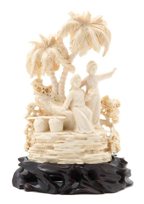 n Ivory Carving of an Oasis depicting two figures above