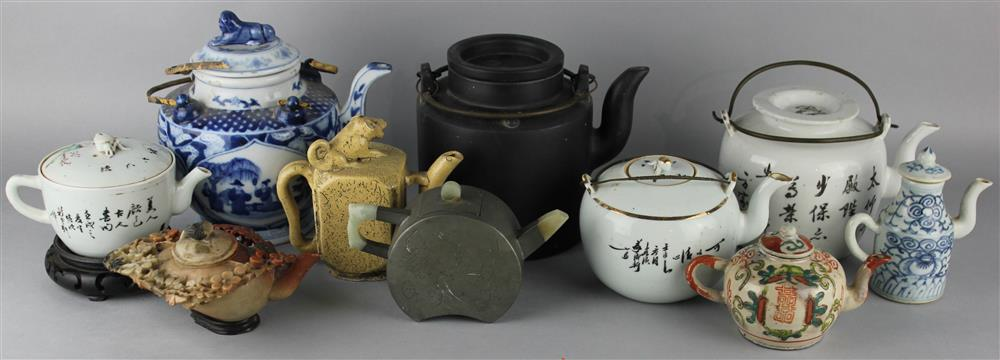 TEN CHINESE TEAPOTS 20TH C the group including a white
