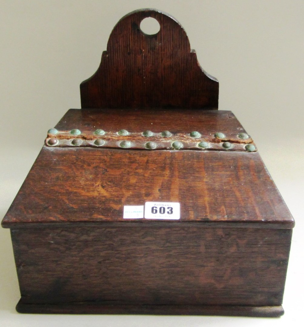 A 19th century oak wall mounted slope front box with
