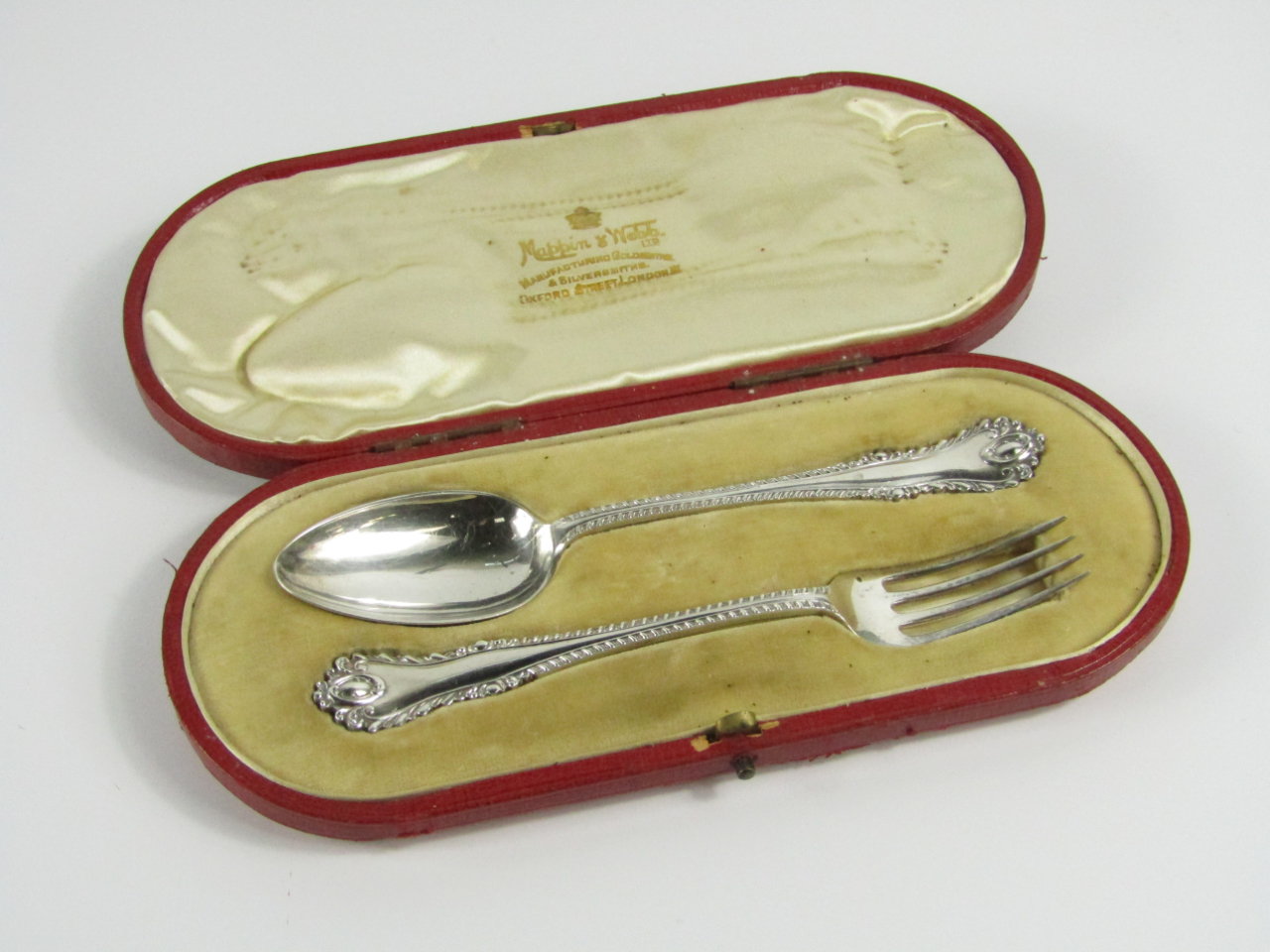An Edwardian silver christening set comprising a spoon and fork