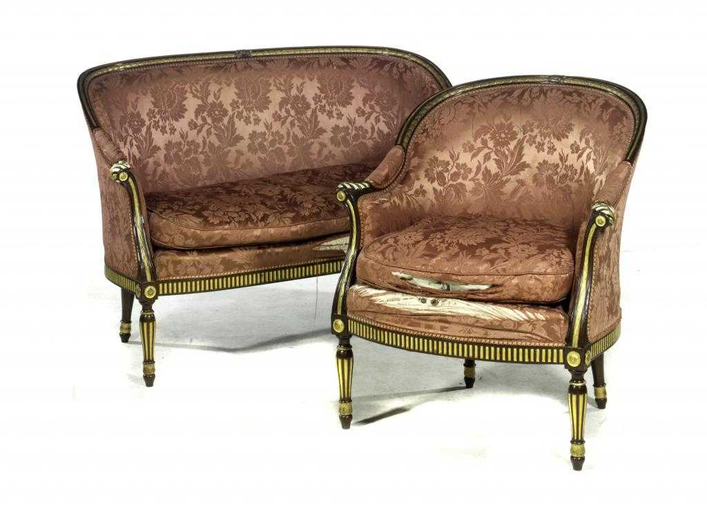A PARCEL GILT MAHOGANY SOFA AND ARMCHAIR the channelled rail