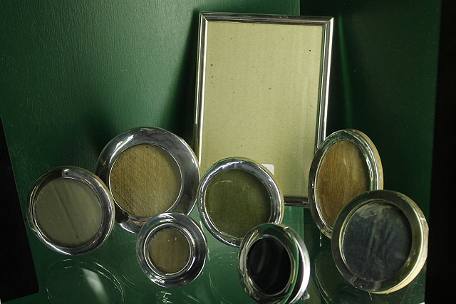 A SMALL COLLECTION OF VARIOUS SILVER AND OTHER PHOTO FRAMES