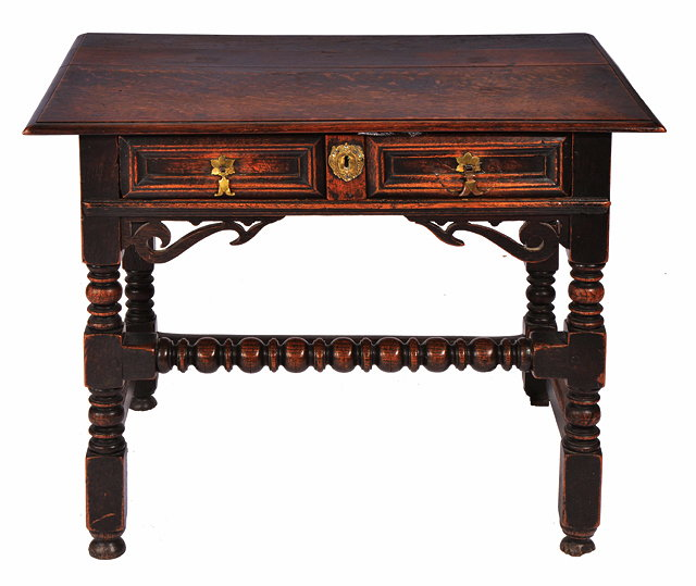 A 17TH CENTURY OAK SIDE TABLE the single frieze drawer