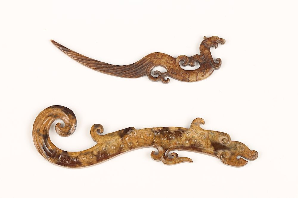 TWO JADE DRAGON PENDANTS A set of two flat pieces