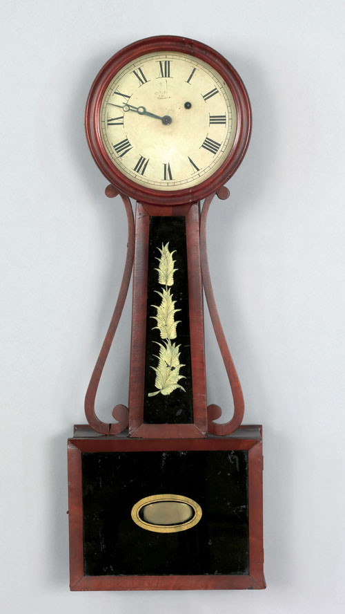 Massachusetts mahogany banjo timepiece ca 1830 with scrolled sidearms and