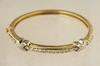 BRACELET 14K yellow and white gold hinged bangle bracelet The