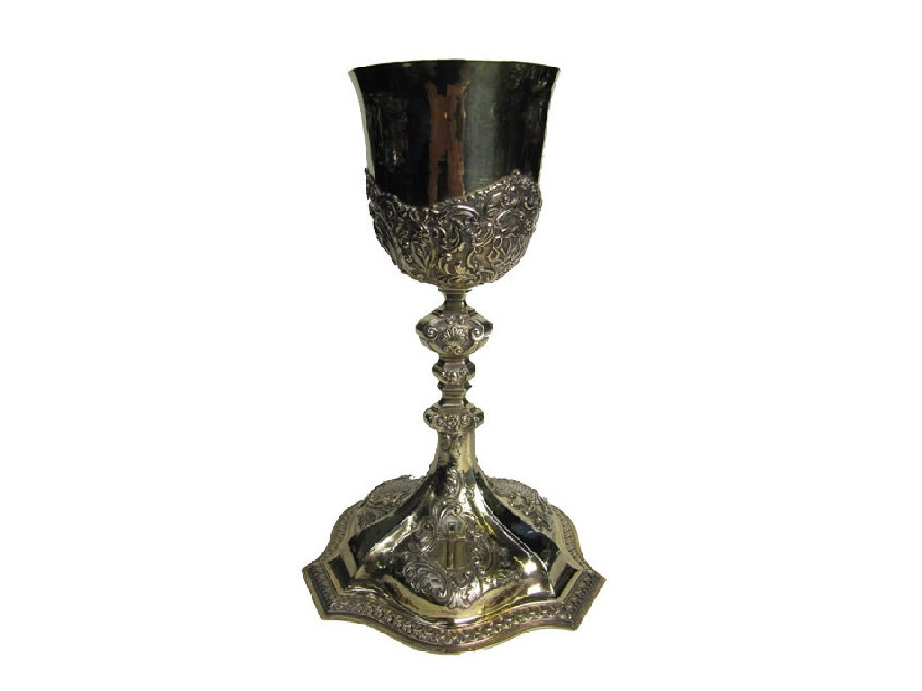 A silver gilt communion chalice the hammered bowl chased with