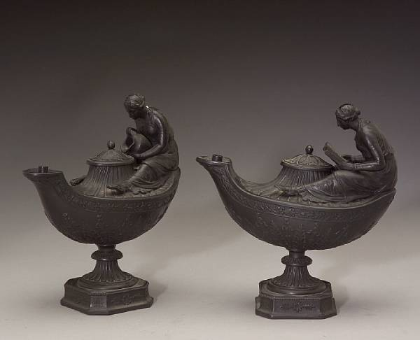 A pair of Wedgwood basalt figural oil lamps and covers