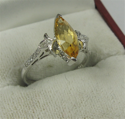 CITRINE DIAMOND AND 18K WHITE GOLD RING centering a marquise
