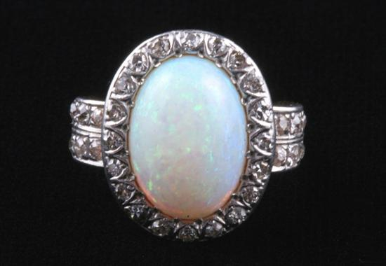 EDWARDIAN PLATINUM ON YELLOW GOLD AND PRECIOUS WHITE OPAL RING
