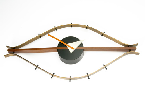 GEORGE NELSON HOWARD MILLER Brass and walnut Eye clock with