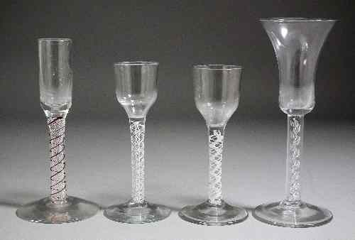 Two cordial glasses with plain bowls and double opaque twist