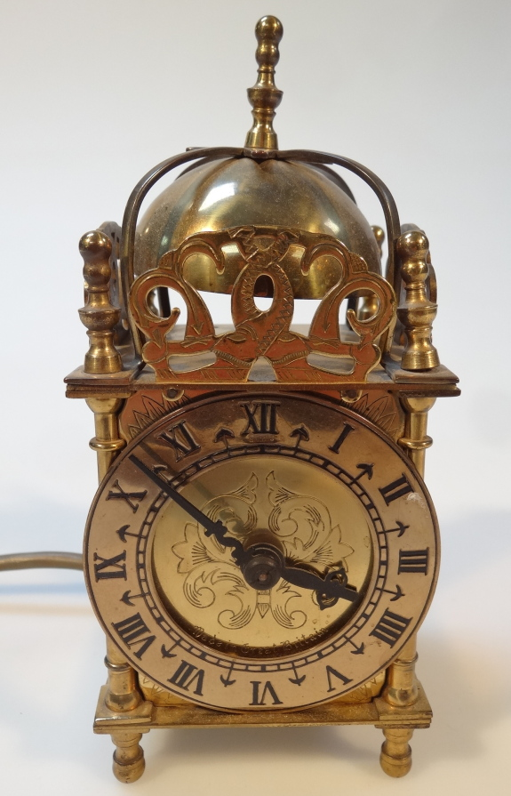 A 20thC brass lantern clock with domed top above a