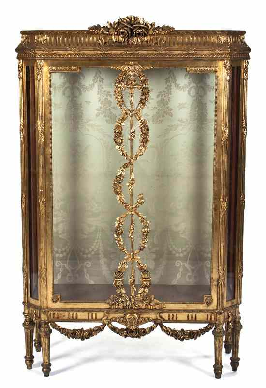 A Louis XVI Style Giltwood Vitrine having ribbon tied floral
