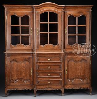 LOUIS XV STYLE OAK BREAKFRONT BOOKCASE Third quarter 20th century