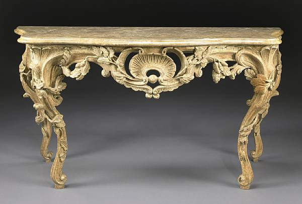An Italian Rococo style oak console table The serpentine variegated