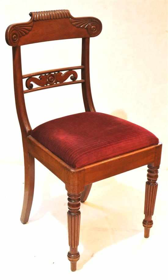 A set of four 19th century mahogany dining chairs Each