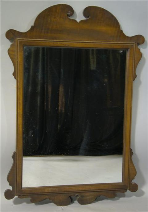 CHIPPENDALE STYLE MAPLE MIRROR The shaped frame enclosing a rectangular