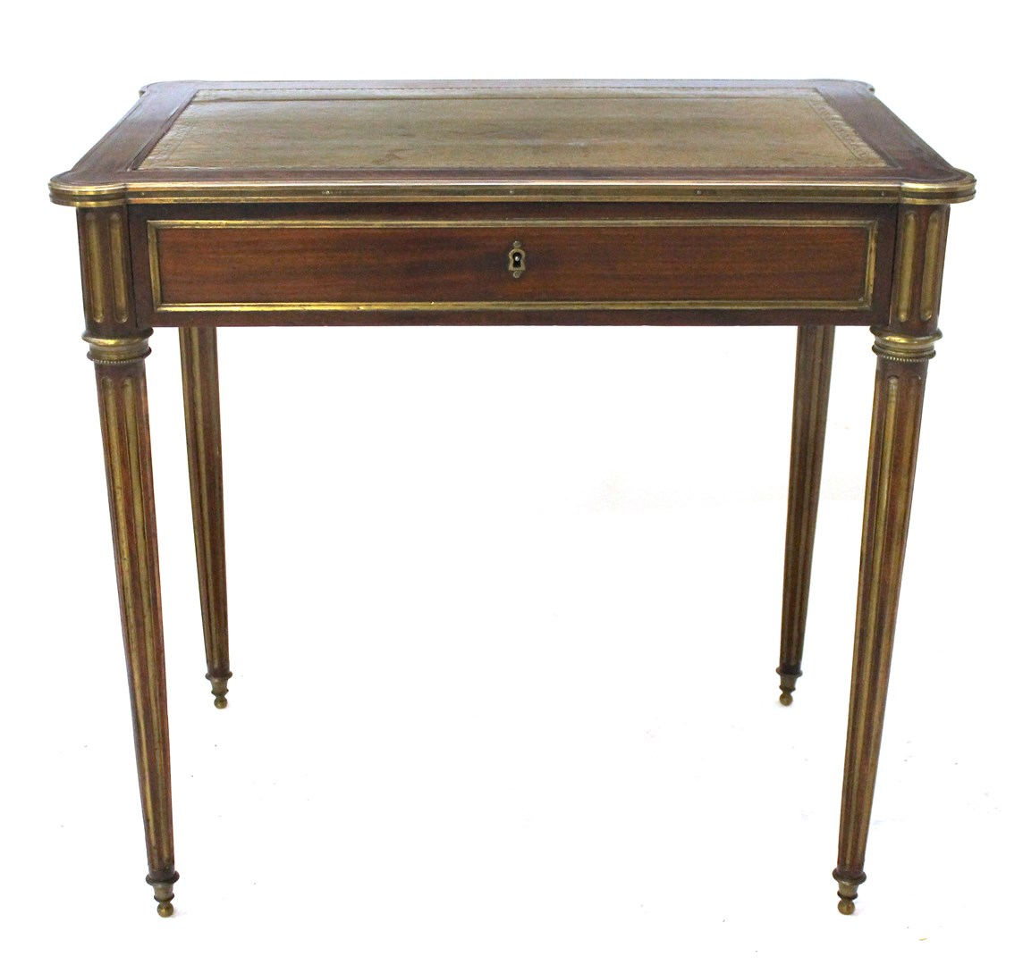 A Louis XVI style brass inlaid mahogany writing table the