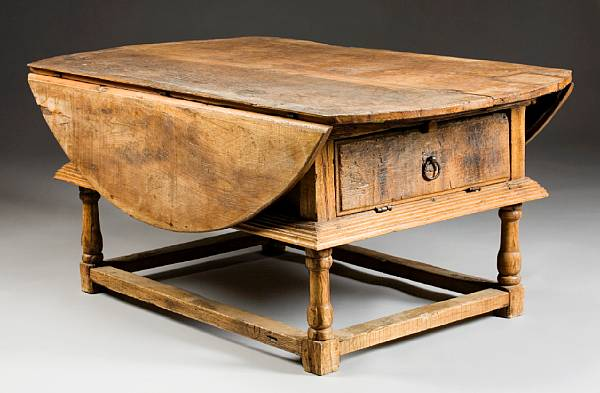 A Spanish Baroque mixed wood drop leaf refectory table Catalan