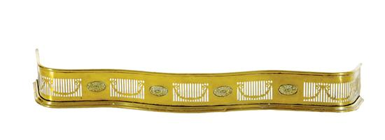 English brass serpentine fire fender circa 1890 scrolling form with