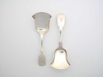 Two very similar George III caddy shovels with fiddle stems