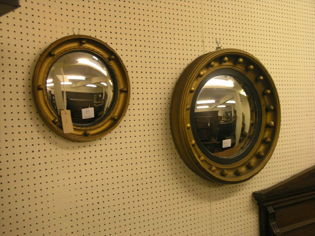 A Victorian mahogany wall hanging dressing mirror oval plate above