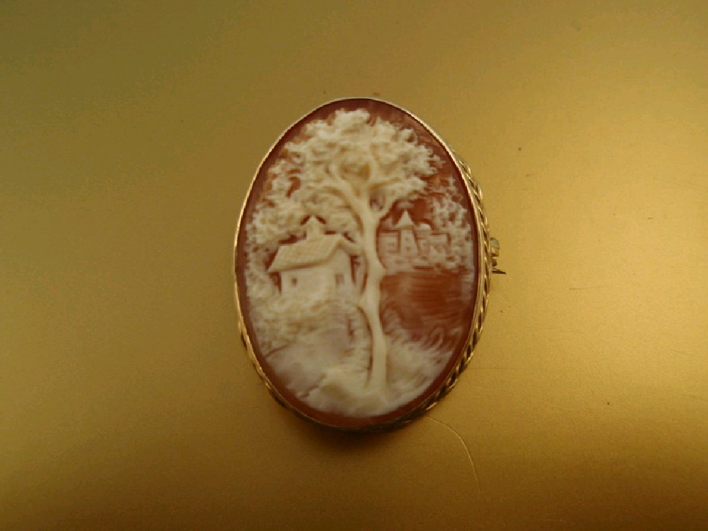 A small shell cameo of an oriental landscape in 9ct