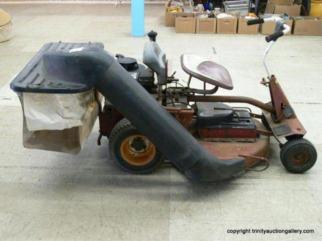 1960 s 8 HP Snapper Riding Lawn Mower with grass
