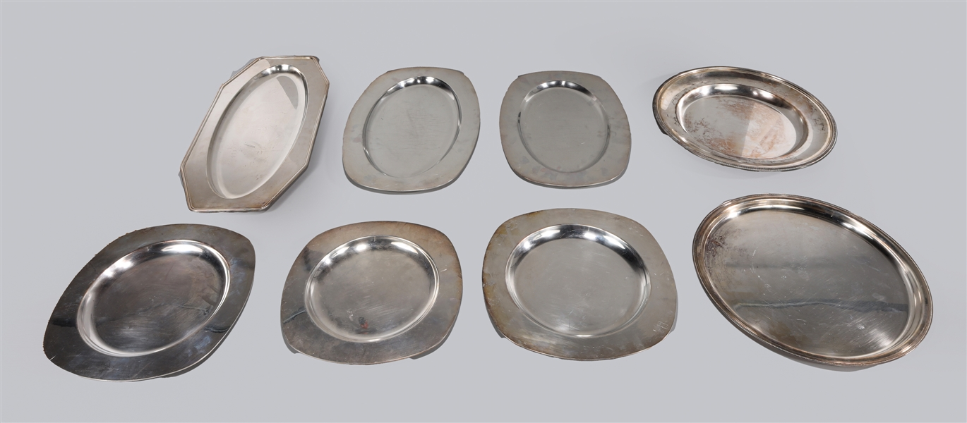 Group of eight Christofle silver plate trays and chargers France