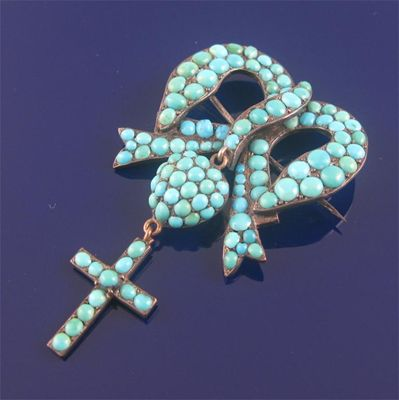 A 19th century turquoise set bow heart and cross brooch