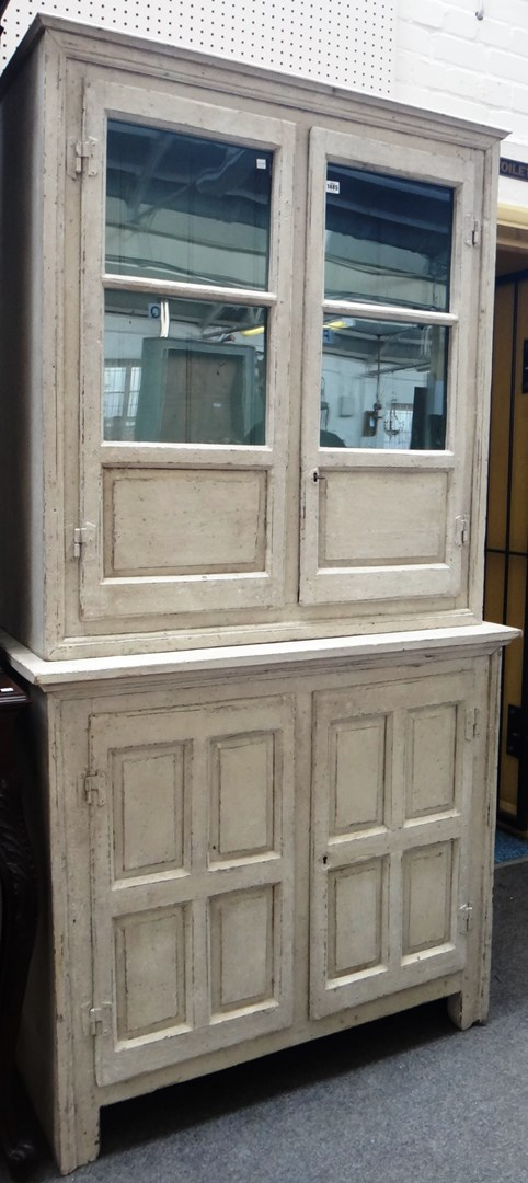 A 19th century continental painted pine display cabinet cupboard with