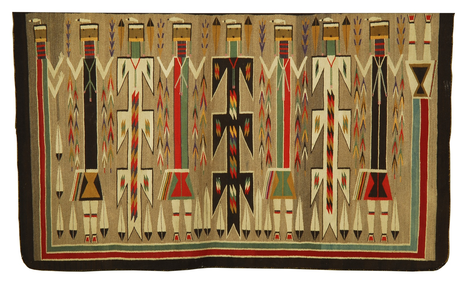 NAVAJO YEI RUG Circa 1935In browns greens reds and oranges